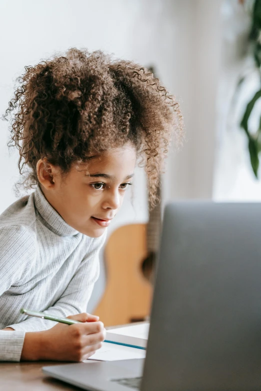 a little boy that is sitting in front of a laptop, light skinned african young girl, girl with brown hair, performing, thumbnail