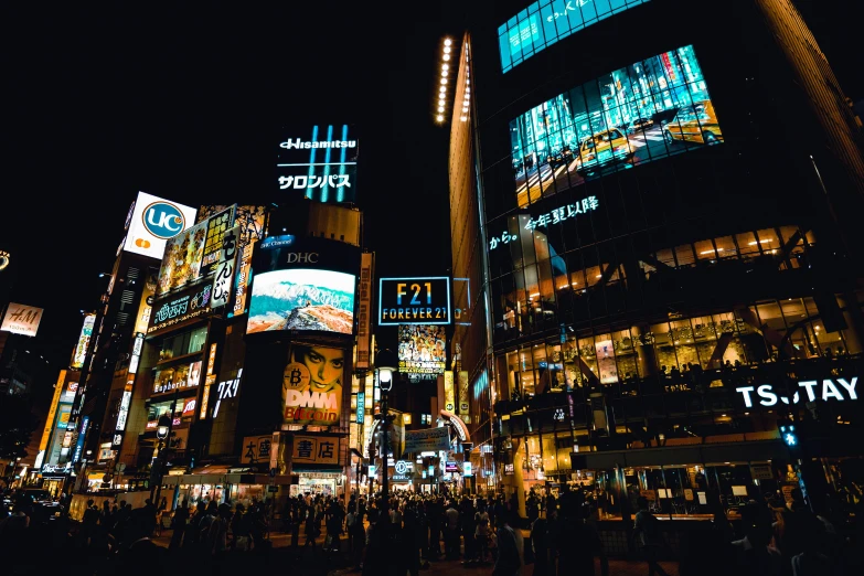 a crowd of people walking through a city at night, a photo, pexels contest winner, ukiyo-e, square, billboard image, beautifully lit buildings, ad image