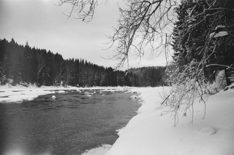 a black and white photo of a snowy river, by Maurycy Gottlieb, nina tryggvadottir, polariod, 1950s photograph, ansel ]