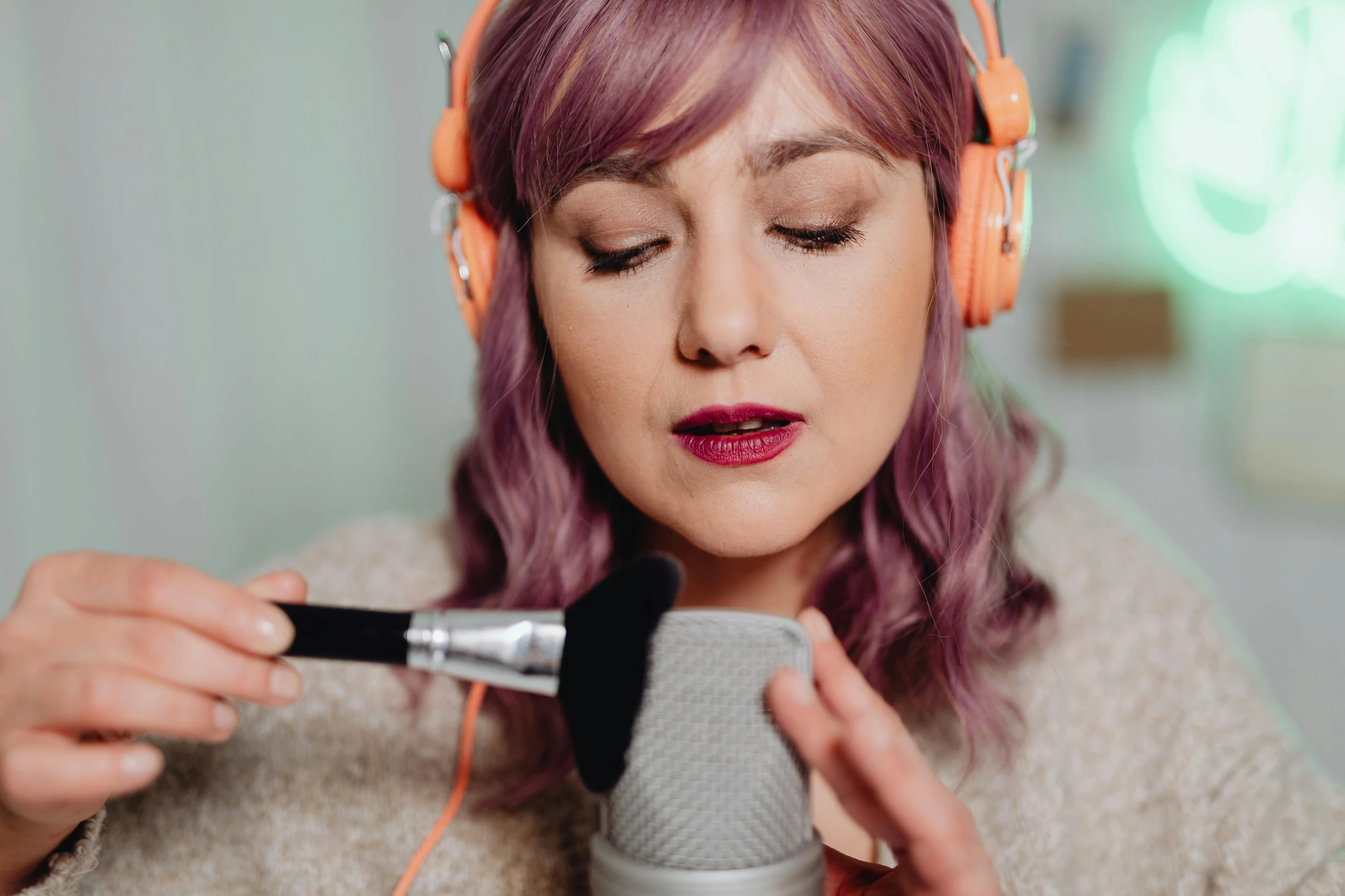 a woman with headphones is singing into a microphone, trending on pexels, tachisme, avatar image, professional makeup, lilac hair, mid shot photo