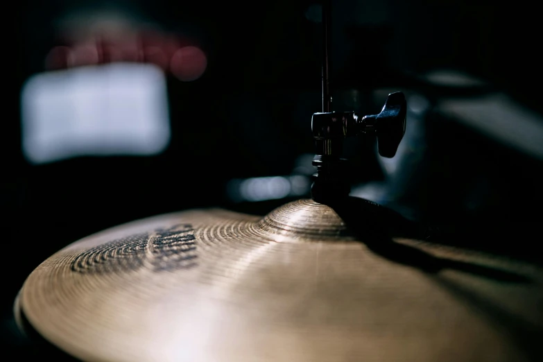 a close up of a drum in a dark room, an album cover, trending on unsplash, photorealism, lots of cymbals, machines cocktail music, 15081959 21121991 01012000 4k, instagram story