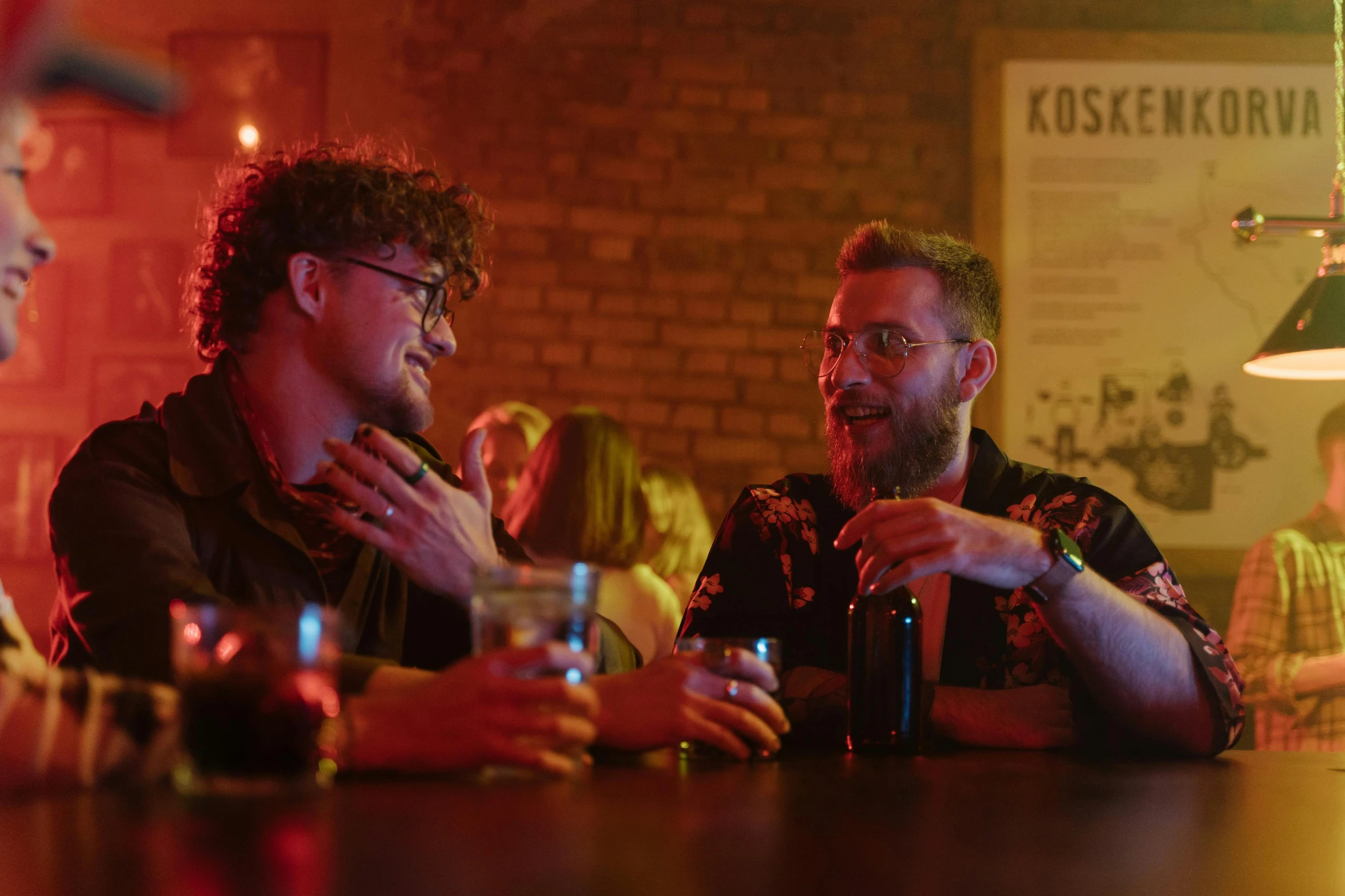 a group of men sitting next to each other at a bar, pexels, serial art, ginger bearded man with glasses, flirting, cinestill 800t 8k, [ theatrical ]