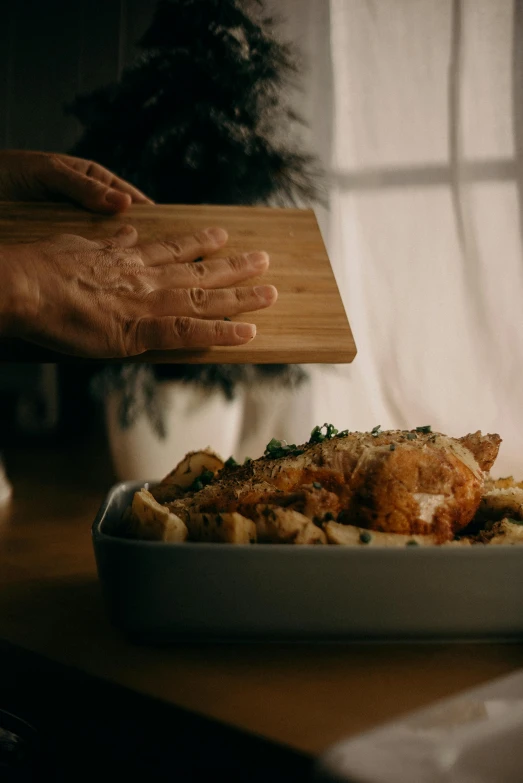 a close up of a plate of food on a table, hands reaching for her, 2 0 2 1 cinematic 4 k framegrab, on a wooden tray, chicken