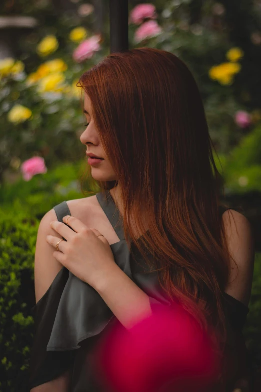 a woman with long red hair sitting on a bench, trending on pexels, flowers in her dark hair, arm around her neck, silky smooth, medium format. soft light