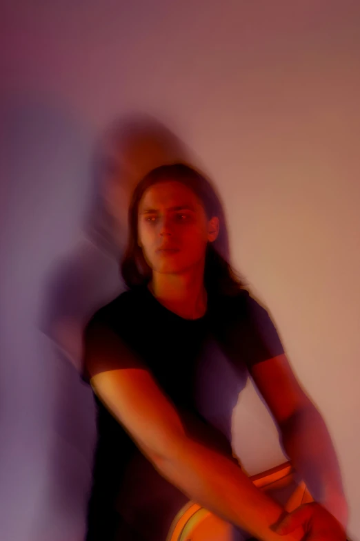 a woman standing in front of a wall holding a frisbee, an album cover, inspired by Lasar Segall, pexels contest winner, happening, databending, androgynous face, portrait soft low light, looking to his left