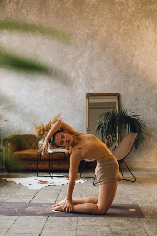 a woman doing a yoga pose in a living room, a picture, inspired by Elsa Bleda, pexels contest winner, renaissance, mirror, arched back, lush surroundings, dynamic dancing pose