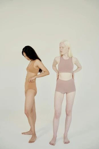 a couple of women standing next to each other, inspired by Vanessa Beecroft, renaissance, pale pink bikini, in muted colors, crop yoga short, silicone skin