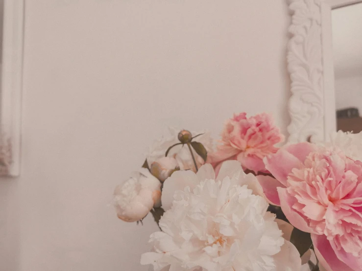 a vase of pink and white flowers in front of a mirror, by Emma Andijewska, trending on unsplash, romanticism, white frame, background image, ivory rococo, many peonies