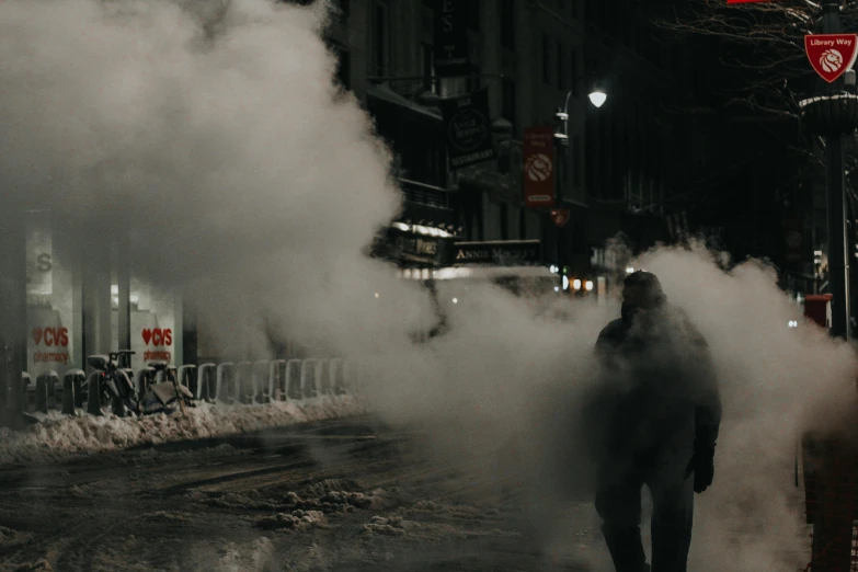 a person walking down a street with a lot of smoke, cold freezing nights, streets of new york, background image