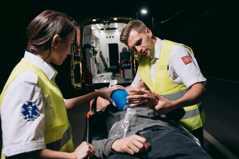 a man on a stretcher being taken to an ambulance, a portrait, by Adam Marczyński, pexels, hurufiyya, wearing hi vis clothing, avatar image, profile picture