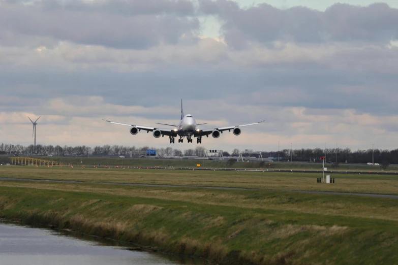 a large jetliner taking off from an airport runway, a picture, by Andries Stock, pexels contest winner, happening, portrait n - 9, springtime, thumbnail, no cropping