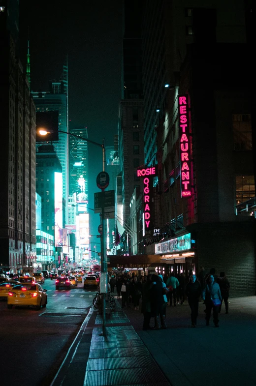 a city street filled with lots of traffic at night, new york buildings, dark teal lighting, pink neon lights, exterior photo