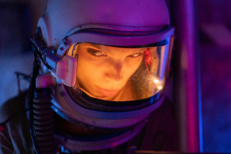 a close up of a person wearing a helmet, pexels, fantastic realism, neon operator margot robbie, astronaut below, scene from the film, mina petrovic