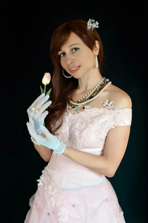 a woman in a pink dress holding a flower, trending on deviantart, white satin gloves, low quality photo, disney!!, real pearls