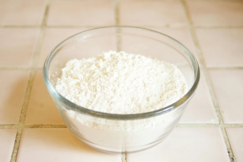 a bowl of flour sitting on a tiled floor, -step 50, fan favorite, translucent skin, thick lining