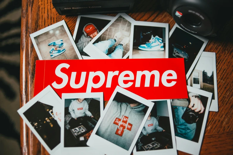 a pile of polaroids sitting on top of a wooden table, a polaroid photo, trending on pexels, surrealism, supreme, trending on r/streetwear, surgeon, sneaker photo