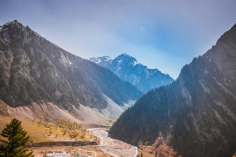 a view of a valley with mountains in the background, pexels contest winner, hurufiyya, ash thorp khyzyl saleem, extremely clear and coherent, larapi, postprocessed