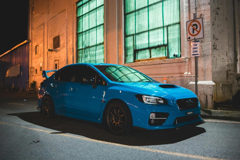 a blue car parked in front of a building, inspired by An Gyeon, pexels contest winner, samurai vinyl wrap, 🚿🗝📝, subaru, late night