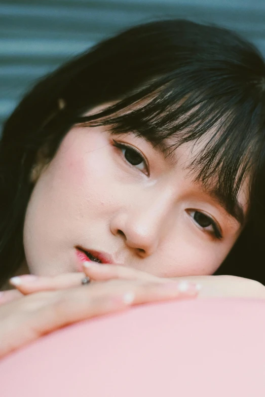 a close up of a person holding a balloon, an album cover, inspired by Kim Jeong-hui, trending on pexels, girl cute-fine-face, bangs, thoughtful ), high angle closeup portrait