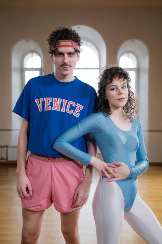 a man standing next to a woman in a blue leo leo leo leo leo leo leo leo leo leo leo leo leo leo leo, an album cover, by Anita Malfatti, renaissance, wearing leotard, still shot from movie, college, russian clothes