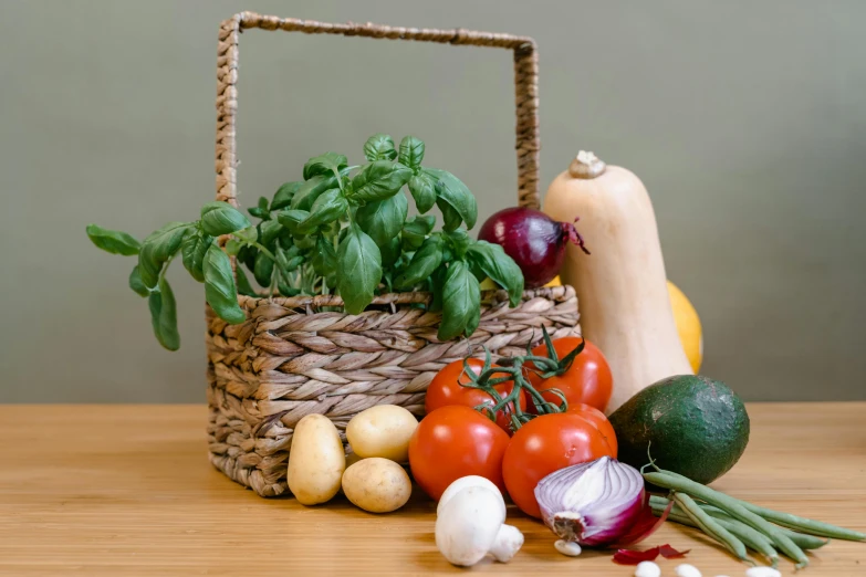 a basket filled with vegetables sitting on top of a wooden table, detailed product image, thumbnail, grey, basil gogos