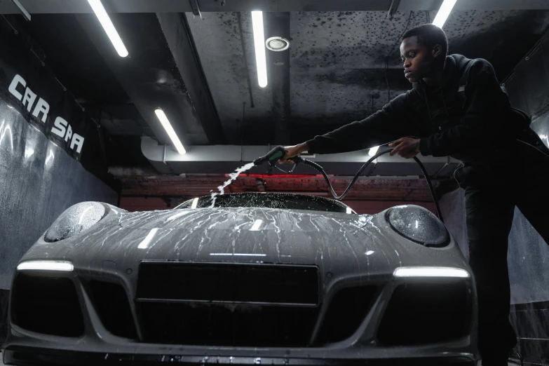 a man washing a sports car in a garage, pexels contest winner, ultra realistic cinematic, mkbhd, people at work, 🦑 design