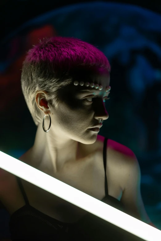 a woman standing in front of a mirror holding a sword, pexels contest winner, afrofuturism, pixie cut with shaved side hair, shot at night with studio lights, ultraviolet photography, a woman's profile