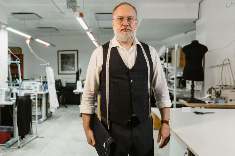 a man standing in front of a sewing machine, wearing a vest and a tie, style of maciej kuciara, avatar image