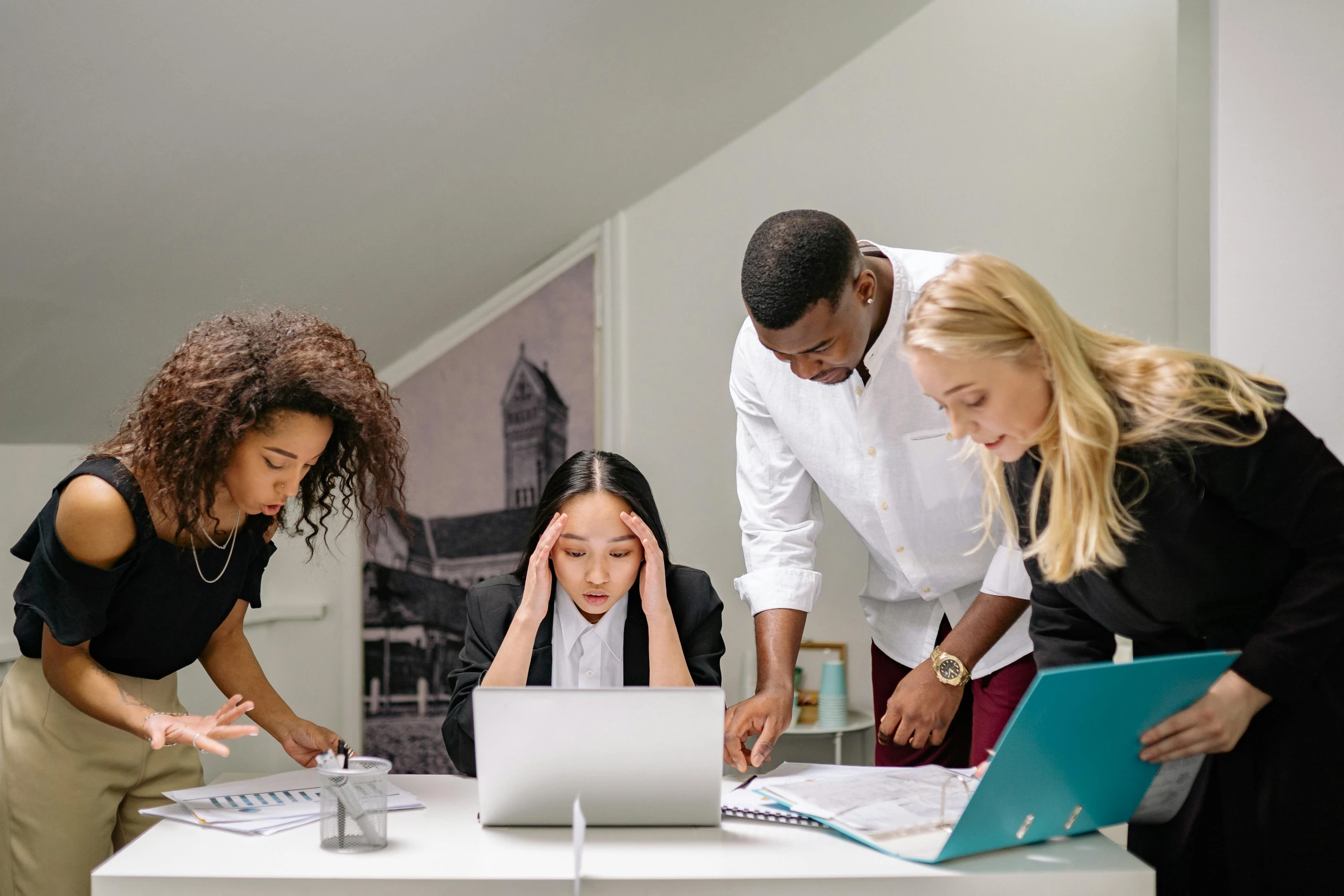a group of people standing around a table with laptops, by Alice Mason, trending on pexels, stressed expression, avatar image, schools, workers