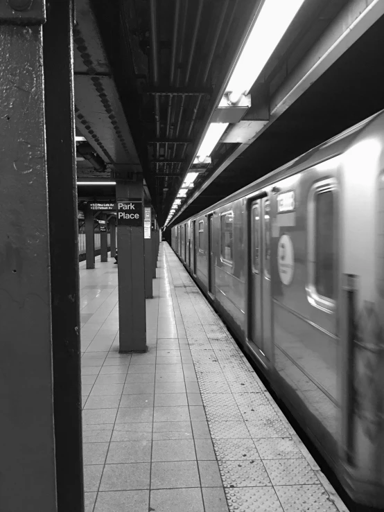 a black and white photo of a subway train, by Adam Rex, taken on iphone 14 pro, distant full body view, fineartamerica, square lines