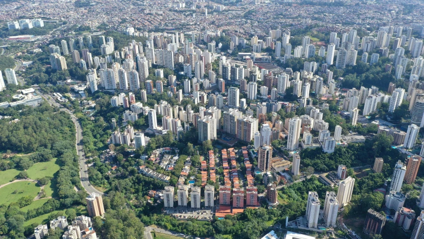 an aerial view of a city with tall buildings, by Ceferí Olivé, hurufiyya, mass housing, sao paulo, waist up, city of the jungle