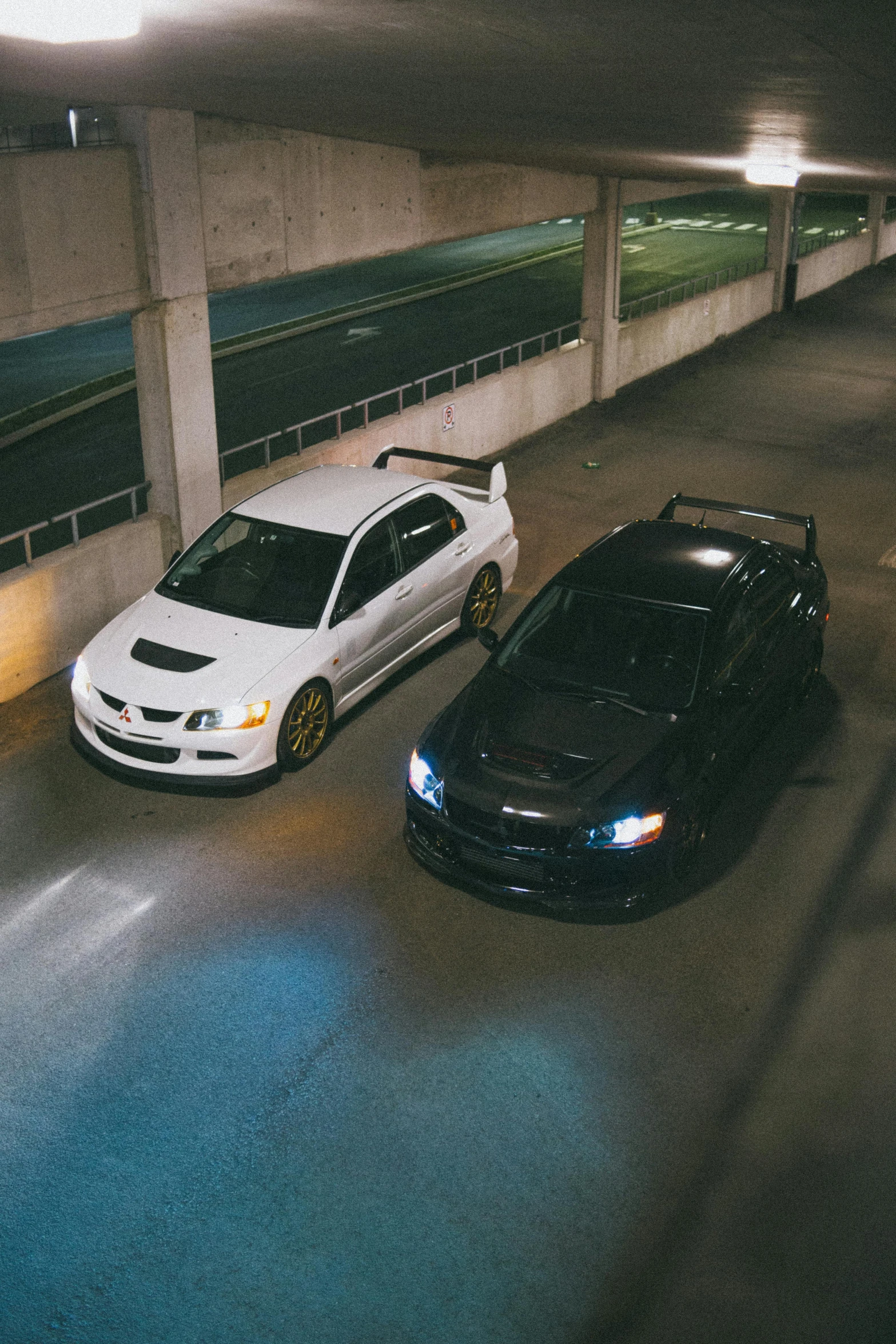 two cars parked next to each other in a parking garage, unsplash, japanese drift car, nightlife, sirius a and sirius b, square