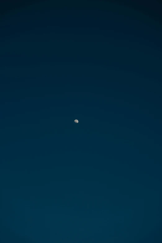 an airplane flying in the sky with the moon in the background, a minimalist painting, by Peter Churcher, unsplash, postminimalism, 2 4 mm iso 8 0 0 color, shot on hasselblad, dark blue, ✨🕌🌙