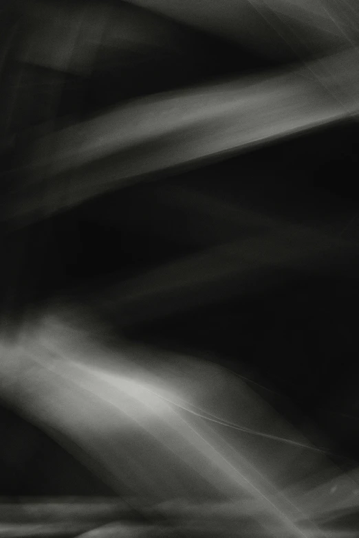 a black and white photo of smoke, an abstract drawing, inspired by Edward Weston, light and space, diagonal strokes, lights beam, photograph taken in 2 0 2 0, (abstract)