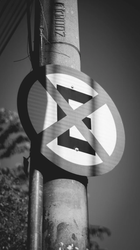 a black and white photo of a street sign, a poster, by Altichiero, excessivism, x logo, digital art - n 5, forbidden, high quality photo