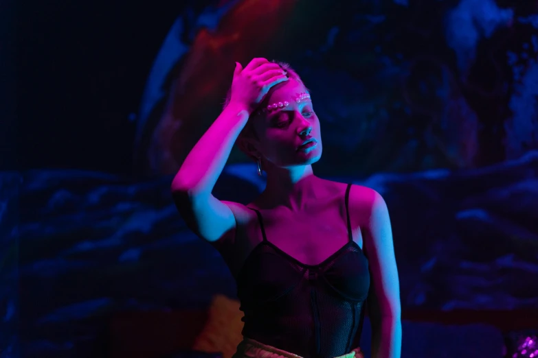 a woman that is standing in the dark, inspired by Elsa Bleda, pexels, aestheticism, black light rave, magenta and blue, concept photoset, instagram post