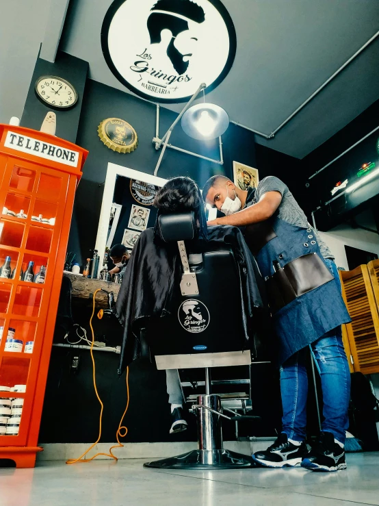 a man getting his hair cut at a barber shop, a photo, by Olivia Peguero, pexels contest winner, grime and grunge, black and brown colors, studio photoshot, airbrush