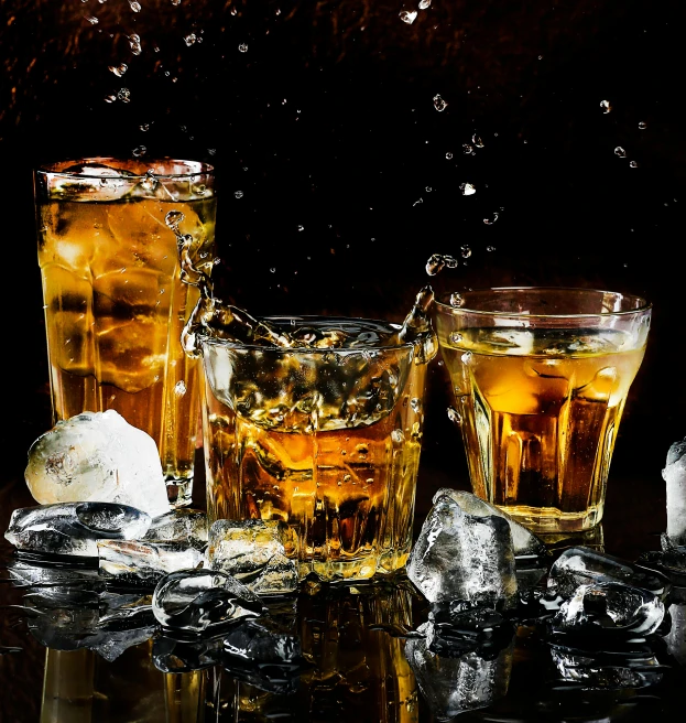 two glasses of whiskey and ice on a table, pexels, photorealism, splashes of liquid, profile image, thumbnail, 6 pack
