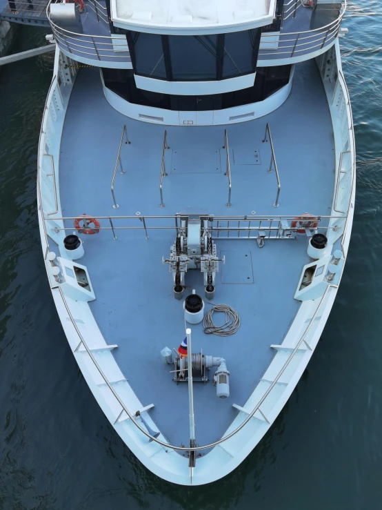 a large white boat in a body of water, a high angle shot, on a boat