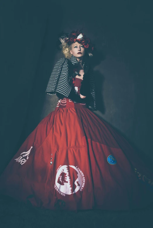 a woman in a red dress posing for a picture, an album cover, inspired by Marie-Gabrielle Capet, cg society contest winner, harajuku fashion, fiberpunk, dressed in long fluent skirt, official store photo