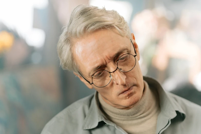 a close up of a person looking at a cell phone, trending on reddit, hyperrealism, dark grey haired man, johan liebert, anomalisa, he has a devastated expression