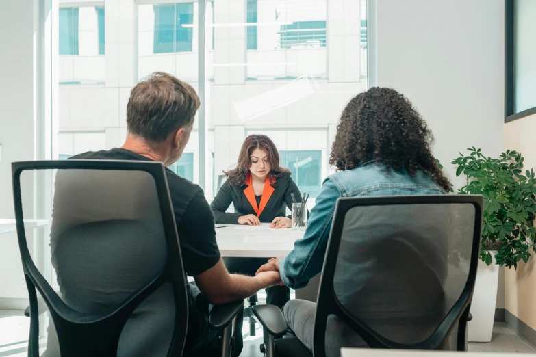 a group of people sitting around a table, in an office, profile image, wētā fx, single subject