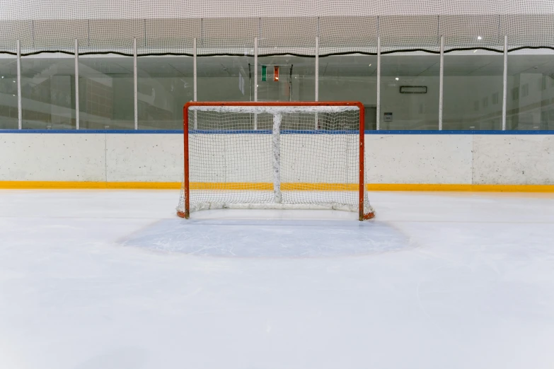 a hockey goal sitting on top of an ice rink, no - text no - logo, full product shot, shot on sony a 7, front profile shot