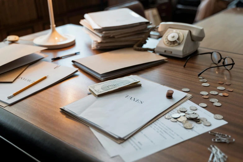 a pile of papers sitting on top of a wooden table, by Daniel Seghers, pexels contest winner, cash on a sidetable, resolute desk, taejune kim, thumbnail