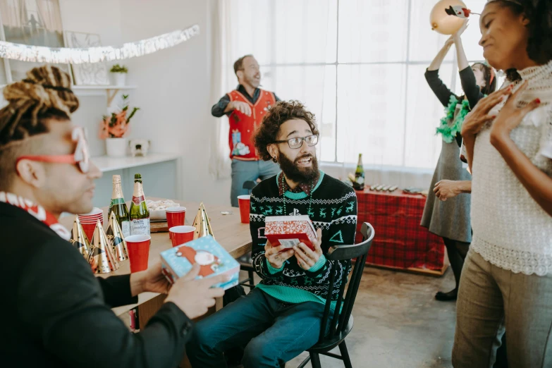 a group of people sitting around a table, pexels contest winner, happening, holding gift, a male elf, having a cool party, gif