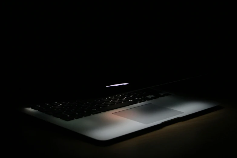 a laptop computer sitting on top of a table, pexels, computer art, lowkey lighting, black interface, lurking, uploaded