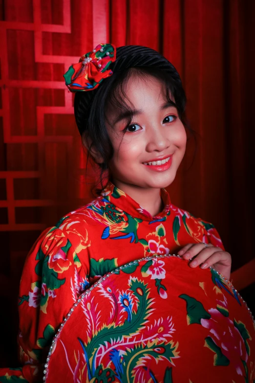 a woman in a red kimono posing for a picture, an album cover, inspired by Mei Qing, pexels contest winner, mingei, young cute wan asian face, ( ( theatrical ) ), slide show, young girl