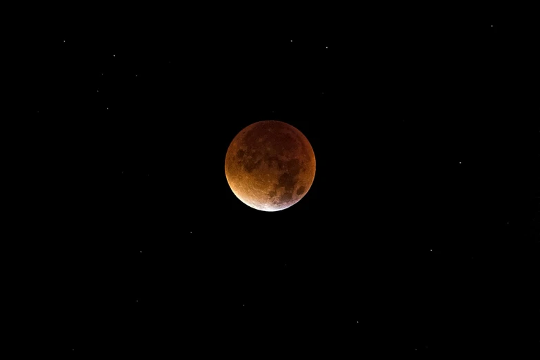 a blood moon with stars in the background, a picture, pixabay, brown, bottom shot, total eclipse, 12mm wide-angle