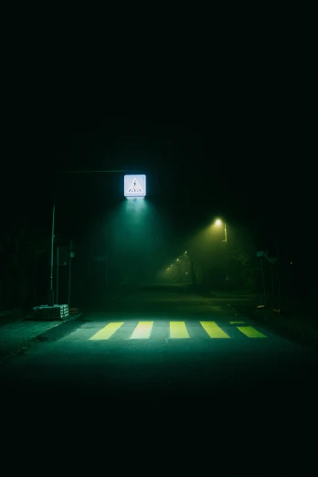 a street light sitting on the side of a road, an album cover, inspired by Elsa Bleda, conceptual art, green scary lights, yellow mist, street signs, low iso