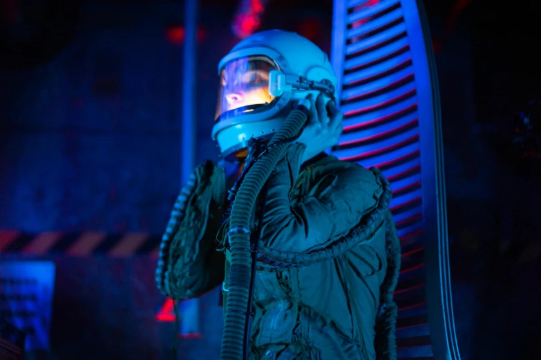 a man in a space suit talking on a cell phone, extremely moody blue lighting, fan favorite, style hybrid mix of beeple, wearing a flying jacket